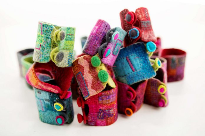 A collection of cuffs made in 2019 by Lakefield textile artist Christianna Ferguson in different bright colours. The materials used in the cuffs is merino wool, silk, and embroidery floss. Ferguson's studio at 16 Bishop Street in Lakefield is Tour Stop 18 on the 2022 Kawartha Autumn Studio Tour, running on September 24 and 25. (Photo courtesy of the Art Gallery of Peterborough)