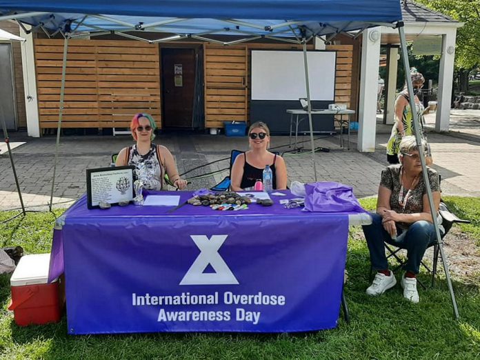 An information booth for International Overdose Awareness Day outside the Silver Bean Cafe in Millennium Park on August 31, 2021. A key focus of the 2022 International Overdose Awareness Day is to correct misinformation and misconceptions about substance use and to reduce the stigma substance users face in the community. (Photo: PARN – Your Community AIDS Resource Network)