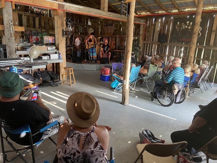 It was an emotional day for several local musicians and live music fans as they gathered on August 7, 2022, for the final music jam to be held at Andy and Linda’s barn near Norwood. The Toughs are downsizing, with the huge farm property up for sale, including the barn. (Photo: Paul Rellinger / kawarthaNOW) 