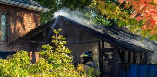 A garage fire on Brunswick Avenue west of High Street in Peterborough has caused an estimated $75,000 in damage. One person was taken to hospital and released. (Photo: David Post)