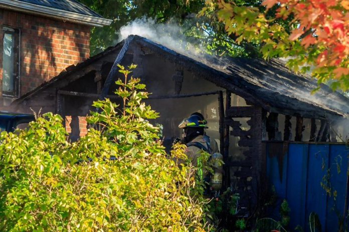 A garage fire on Brunswick Avenue west of High Street in Peterborough has caused an estimated $75,000 in damage. One person was taken to hospital and released. (Photo: David Post)