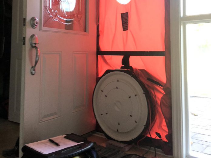 A blower door is used by an EnerGuide-certified energy advisor to create pressure inside a home and measure air leakage. This test provides a homeowner with critical information on how to prevent heat from escaping and reduce energy spent on heating and cooling. (Photo: GreenUP)