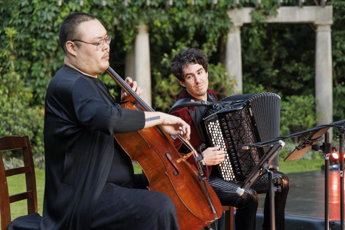 Cellist Daniel Hamin Go, accordionist Michael Bridge, and clarinetist Brad Cherwin (not pictured) of Toronto's Royal Conservatory of Music will accompany the movements of four dancers and jugglers with a performance of original new arrangements of familiar compositions.  (Photo: Bruce Zinger)