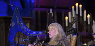 During her "Under A Winter's Moon" tour, Loreena McKennitt will sing and play harp, keyboard, and accordion, accompanied by musicians Caroline Lavelle, Graham Hargrove, Errol Fischer, Pete Watson, and Cait Watson. The concert will also feature readings by Tom Jackson (pre-recorded), Cedric Smith, and Jeffrey "Red" George. (Photo via Under A Winter's Moon website)