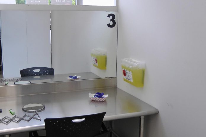 One of the three consumption booths at the Consumption and Treatment Services site (CTS), located at the Opioid Response Hub at 220 Simcoe Street in downtown Peterborough. Each booth has a mirror so the on-site paramedic can observe people as they prepare and consume their substances. (Photo: Bruce Head / kawarthaNOW)