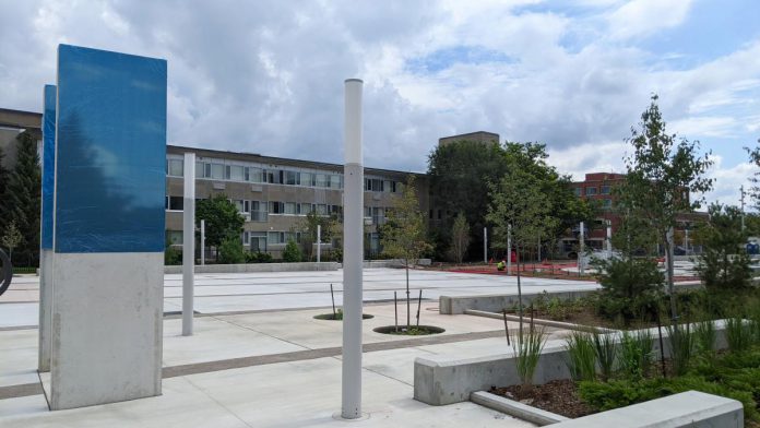 The UN Peacekeepers Monument (left), unveiled in July 2022, at the urban park near the intersection of Charlotte and Aylmer streets in downtown Peterborough. (Photo: Bruce Head / kawarthaNOW)