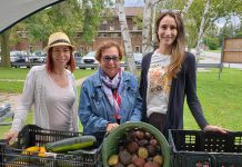 Penny Barton Dyke (middle), Shantal Ingram (left), and Emily Beall (right) at the Edwin Binney's Community Garden Farm Stand at 50 Mary Street West in Lindsay. Barton Dyke is retiring as executive director of United Way for the City of Kawartha Lakes after more than 17 years in the position. Ingram and Beall are the organization's new co-executive directors. (Photo courtesy of United Way for the City of Kawartha Lakes).