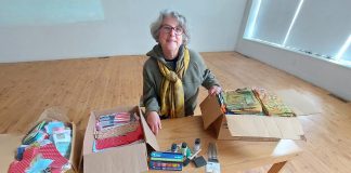Community member Sue displays some of the art and craft supplies recently donated to Artspace Peterborough for its new maker space, scheduled to open in early 2023. (Photo: Artspace Peterborough / Facebook)