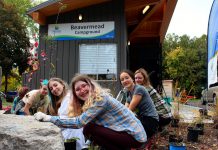 Some of the students in the Kawartha Pine Ridge District School Board's Youth Leadership in Sustainability Program who helped install a rain garden at Beavermead Campbround's new gatehouse in Peterborough. (Photo courtesy of Otonabee Conservation)