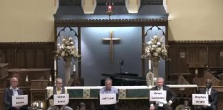 Peterborough mayoral candidates listen to a question from an audience member during a debate on October 5, 2022 hosted by the United Way of Peterborough & District at All Saints' Anglican Church. (kawarthaNOW screenshot)