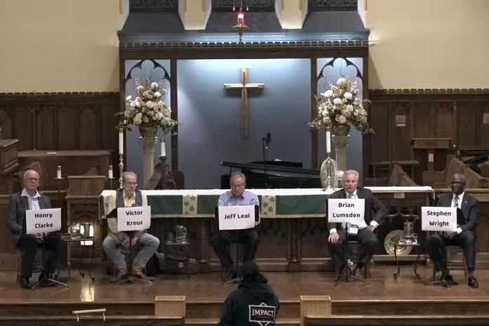 Peterborough mayoral candidates listen to a question from an audience member during a debate on October 5, 2022 hosted by the United Way of Peterborough & District at All Saints' Anglican Church. (kawarthaNOW screenshot)