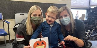 More than 400,000 children in Canada have special needs that may prevent them from enjoying trick-or-treating with their siblings and other children. There are simple ways of making Halloween more accessible and inclusive for kids of all ages and abilities, including two-year-old Xavier, pictured with his mom Jessica (left) and Five Counties Children's Centre staff member Ange. (Photo courtesy of Five Counties Children's Centre)