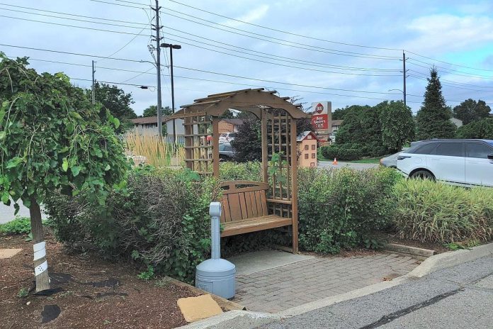 Adding rain gardens and even aesthetic design elements like benches can help transform a parking lot from grey to green. (Photo: GreenUP)