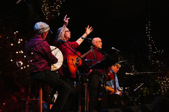 Rob Fortin, Susan Newman, and John Hoffman performing as Carried Away with multi-instrumentalist Michael Ketemer and Celtic harpist Tanah Haney (not pictured) at the 2019 In From The Cold concert. One of Peterborough's most cherished Christmas concerts, it offers an enchanting mix of Celtic-style carols and seasonal songs you won't hear at other concerts, performed by some of Peterborough's top folk and roots musicians. (Photo: Alnis Dickson)