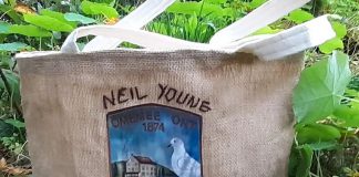 Volunteers with Creating Space Community Arts Studio in Peterborough have stitched and embroidered four fully lined bags using recycled burlap from the stage of Neil Young's December 2017 "Home Town" concert at Omemee's Corontation Hall. The bags, which also feature the image from the stage backdrop, will be auctioned off on November 4 and 5, 2022 to raise funds for the non-profit organization's local arts initiative. (Photo: Creating Space / Instagram)