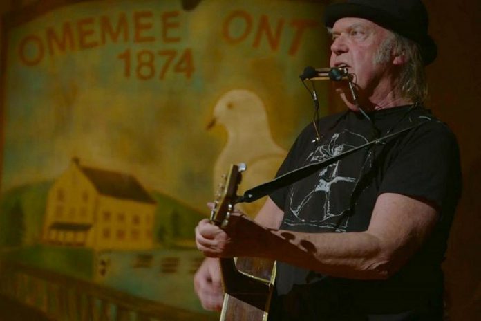 Neil Young performing at Coronation Hall in Omemee, Ontario, on December 1, 2017 as part of his "Home Town" concert that was livestreamed in Canada and around the world. (kawarthaNOW screenshot)