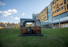 One of two sculptures entitled "Portal" by Canadian artist and Trent University alumnus David James. Located on the slope between the Chemical Sciences Building and Gzowski College, this sculpture weighs 3,600 kilograms and is carved from Belfast Black granite from South Africa. (Photo courtesy of Trent University)