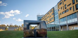 One of two sculptures entitled "Portal" by Canadian artist and Trent University alumnus David James. Located on the slope between the Chemical Sciences Building and Gzowski College, this sculpture weighs 3,600 kilograms and is carved from Belfast Black granite from South Africa. (Photo courtesy of Trent University)