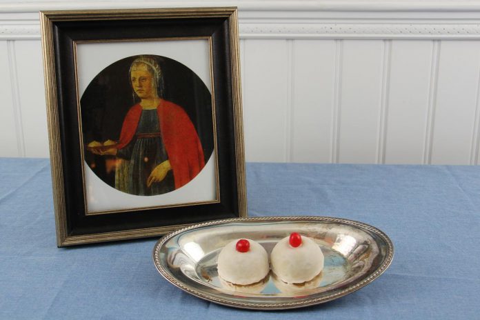 Saint Agatha is often depicted in art carrying her excised breasts on a platter. "Minne di Sant'gata" ("Saint Agatha's breasts") is a traditional breast-shaped pastry served during the Festival of Saint Agatha, an annual religious festival taking place during February in the city of Catania in Sicily.  (Photo: Bakers Across Europe)