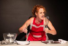 Peterborough theatre artist Sarah McNeilly, a two-time breast cancer survivor and sexual assault survivor, performing in her solo work "Titty Cakes: A Recipe for Radical Acceptance." During the performance, which contains mature themes, McNeilly will attempt to bake "Minne di Sant'gata" ("Saint Agatha's breasts"), a traditional breast-shaped pastry served during the Festival of Saint Agatha, the patron saint of breast cancer patients, rape victims, wet nurses, bakers, and bellfounders. (Photo: Andy Carroll)