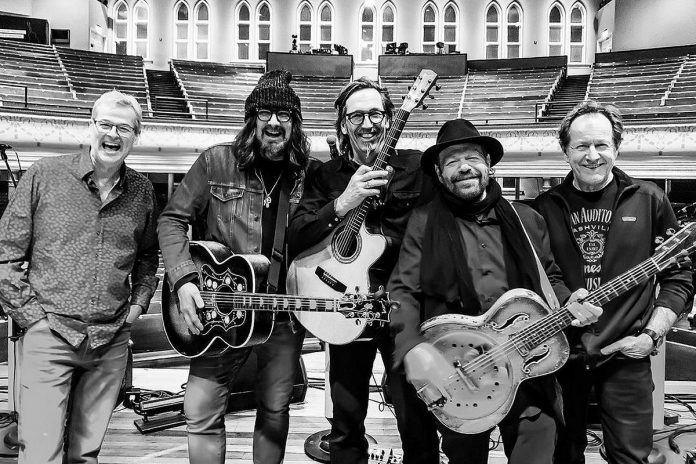 Blackie and the Rodeo Kings (John Dymond, Tom Wilson, Stephen Fearing, Colin Lnden, and Gary Craig) dueing a soundcheck at he Grand Ole Opry in Nashville in February 2020, just prior to the pandemic. (Photo courtesy of Blackie and the Rodeo Kings)