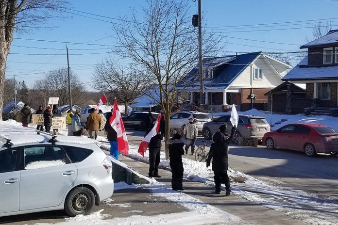 Anti-vax protesters gather outside the East City home of Peterborough medical officer of health Dr. Thomas Piggott on January 15, 2022. Four days later, Dr. Piggott opened his door to an anti-vax protester (later arrested) pretending to be a neighbour who was welcoming him to the neighbourhood. (Photo: kawarthaNOW)