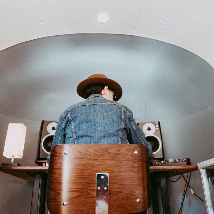 Sound engineer James McKenty at work inside In Record Time Studio, a mobile recording studio in a vintage Airstream trailer. Easily recognized by the distinctive shape of its rounded and polished aluminum coachwork, the studio "looks like a spaceship going down the road" according to James.  (Photo courtesy of the McKentys)