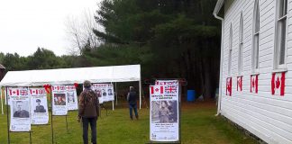 Some of the 40 flags depicting individuals associated with Irondale who served Canada in various aspects of war on display on the grounds of the historic Irondale Church in Minden Hills during "Service, Courage & Sacrifice" from November 5 to 13, 2022. (Photo: Bark Lake Cultural Developments / Facebook)