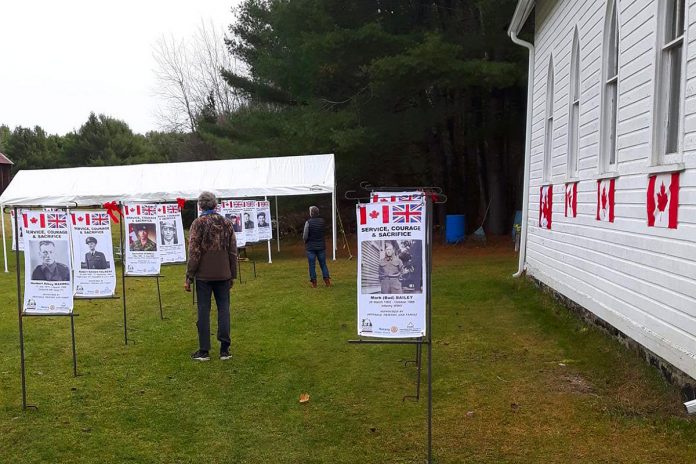 Some of the 40 flags depicting individuals associated with Irondale who served Canada in various aspects of war on display on the grounds of the historic Irondale Church in Minden Hills during "Service, Courage & Sacrifice" from November 5 to 13, 2022. (Photo: Bark Lake Cultural Developments / Facebook)