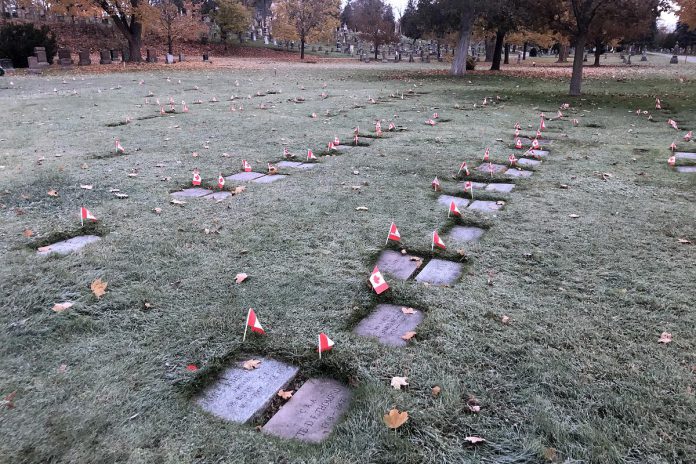 Local students have been placing Canadian flags at individual veteran's graves in Peterborough's Little Lake Cemetery in association with the No Stone Left Alone Memorial Foundation.  (Photo courtesy of Little Lake Cemetery Co.)