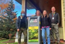 Pictured at one of the new needie disposal bins in Haliburton County is PARN harm reduction worker Katlin Archibald, Municipality of Dysart manager of programs and events Andrea Mueller, Haliburton Kawartha Pine Ridge District Health Unit health promoter Kate Hall, and Haliburton County Public Library CAO Chris Stephenson. (Photo courtesy of Haliburton Kawartha Pine Ridge District Health Unit)