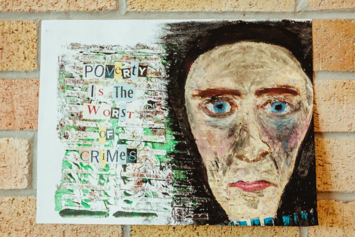 "Poverty is the worst of crimes." One of the artworks created at One City Peterborough's open art drop-in studio which was on display at the Peterborough Public Library in September and October 2022. (Photo: One City Peterborough)
