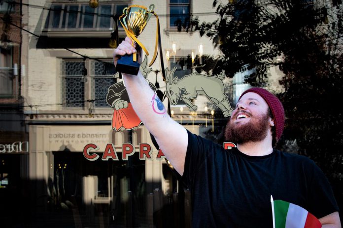 Capra Toro's lead pasta chef Nathan Manwell celebrating his restaurant's win in the 2022 Peterborough Mac + Cheese Festival, shared with The El (P). (Photo courtesy of Peterborough Downtown Business Improvement Area)