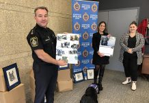 Representatives from the Peterborough Police Service's K9 unit and victim services (including facility dog Pixie) and Peterborough Humane Society unveiled the new K9 calendar at the police station on November 17, 2022. All proceeds from the sale of the calendar will go to the Peterborough Humane Society for the new Peterborough Animal Care Centre. (Photo: Peterborough Police Service / Facebook)