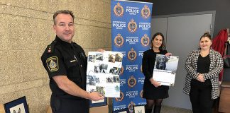 Representatives from the Peterborough Police Service's K9 unit and victim services (including facility dog Pixie) and Peterborough Humane Society unveiled the new K9 calendar at the police station on November 17, 2022. All proceeds from the sale of the calendar will go to the Peterborough Humane Society for the new Peterborough Animal Care Centre. (Photo: Peterborough Police Service / Facebook)