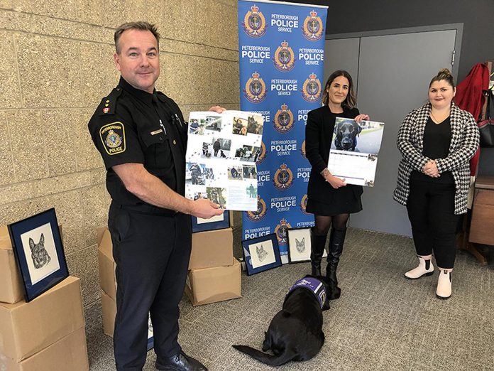 Representatives from the Peterborough Police Service's K9 unit and victim services (including facility dog Pixie) and Peterborough Humane Society unveiled the new K9 calendar at the police station on November 17, 2022. All proceeds from the sale of the calendar will go to the Peterborough Humane Society for the new Peterborough Animal Care Centre. (Photo: Peterborough Police Service / Facebook)