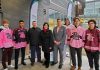Peterborough Petes players wearing past Pink in the Rink jerseys flank Petes general manager Michael Oke, Peterborough Regional Health Centre (PRHC) Foundation president and CEO Lesley Heighway, and Petes executive director Burton Lee during a media announcement for the 2023 Pink in the Rink campaign at PRHC on November 30, 2022. (Photo courtesy of PRHC Foundation)
