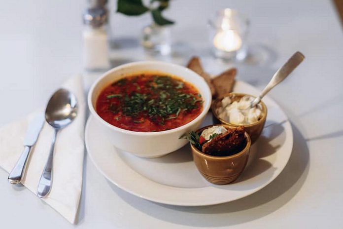 Operated by Ukrainian refugee families, Cafe Lviv at 90 Mill Street North in downtown Port Hope serves authentic Ukrainian cuisine including borscht (pictured), nalysnyky, kanapky, Chicken Kyiv, deruny, varenyky, holubtsi, and more. (Photo: Mira Knott / Knott Studio)