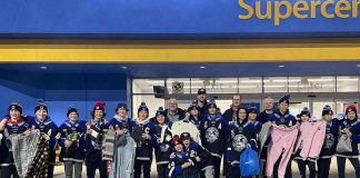 The players and coaches of the Central Ontario Wolves under-13 team with some of the items they purchased on November 29, 2022 for local families in need. Front row: Dylan Hoare and Quinnton Bowler. Middle row: Gabe Stone, Caden Cousineau, Tyson Hawley, Marcus Kennedy, Gage Cooper-Bailey, Mason Quinn, Karter Brideau, Prestin Allen, Finn Ellery, Liam Williams, Stephen Hutchinson, Ethan Davidson, Cole Roberts, Kyler Lauder, and Brayden Evans. Back row: head coach Chad Birkhof and assistant coaches Doug Hinan, Denis Lemoire, and Mitch Madgett. (Photo courtesy of Central Ontario Wolves)