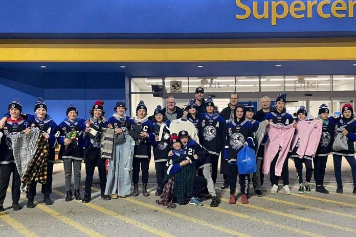 The players and coaches of the Central Ontario Wolves under-13 team with some of the items they purchased on November 29, 2022 for local families in need. Front row: Dylan Hoare and Quinnton Bowler. Middle row: Gabe Stone, Caden Cousineau, Tyson Hawley, Marcus Kennedy, Gage Cooper-Bailey, Mason Quinn, Karter Brideau, Prestin Allen, Finn Ellery, Liam Williams, Stephen Hutchinson, Ethan Davidson, Cole Roberts, Kyler Lauder, and Brayden Evans. Back row: head coach Chad Birkhof and assistant coaches Doug Hinan, Denis Lemoire, and Mitch Madgett. (Photo courtesy of Central Ontario Wolves)