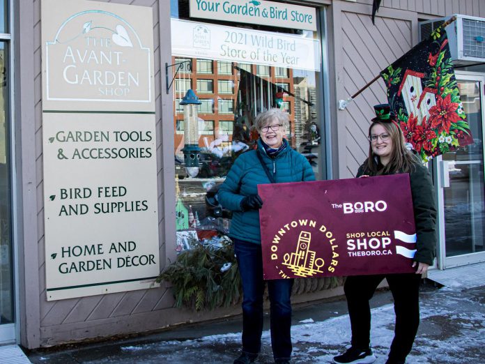Karen Scott (left) celebrates her win of a $500 Boro gift card as well as a Peterborough Musicfest Diner's Book with Avant-Garden Shop customer service representative Marissa Dunk. Scott won the second early bird draw of the Peterborough Downtown Business Improvement Area (DBIA) annual Holiday Shopping Passport program. She completed her winning passport at the Avant-Garden Shop at 165 Sherbrooke Street in downtown Peterborough, where she purchased some Christmas presents for her family and garden supplies. (Photo courtesy of Peterborough DBIA)
