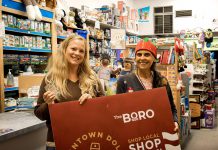 Heather Adey (left) displays her winning holiday shopping passport with The Toy Shop owner Jean Grant. Adey, who completed her passport after purchasing a selection of board games and ice bubbles for her two young daughters, receives a $500 Boro gift card as well as a Peterborough Musicfest Diner's Book. (Photo courtesy of Peterborough DBIA)