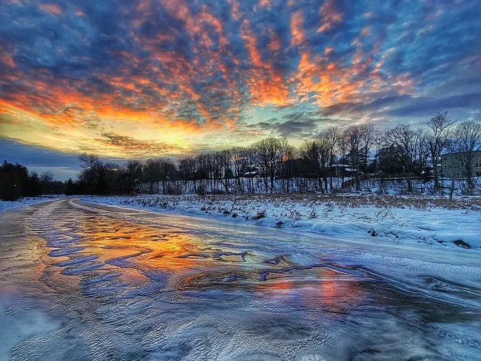 This photo of a sunset over frozen Baxter Creek in Millbrook by Kirk Hillsley was our top post on Instagram for December 2022. (Photo: Kirk Hillsley @kirkhillsley / Instagram)