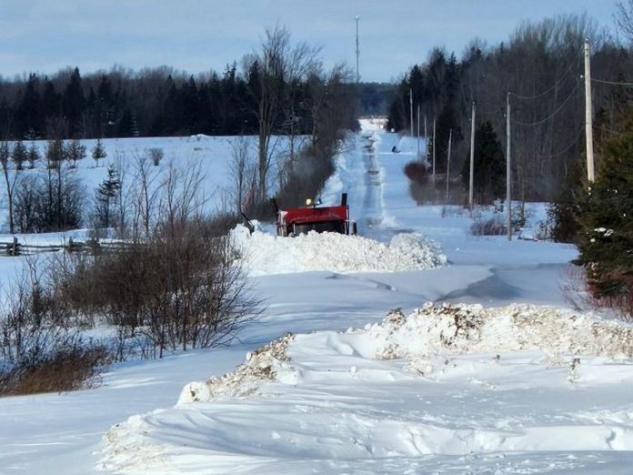 Snow plow trucks work to clear a rural road in the City of Kawartha Lakes following the December 2022 winter storm. In some areas, it is taking an hour to clear one kilometre of road. (Photo: City of Kawartha Lakes)
