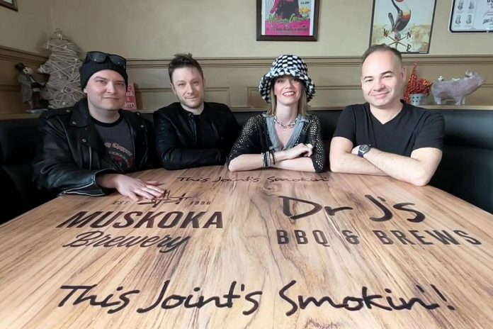 Live Shiny Tunes (Devin McManus, Dawson McManus, SJ Riley, and Michael Beauclerc) will make their debut on New Year's Eve at Dr. J's BBQ & Brews in downtown Peterborough, performing the best hits of the '90s. (kawarthaNOW screenshot of Facebook video)