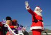 Santa in a sleigh during a Santa Claus parade. (Stock photo)