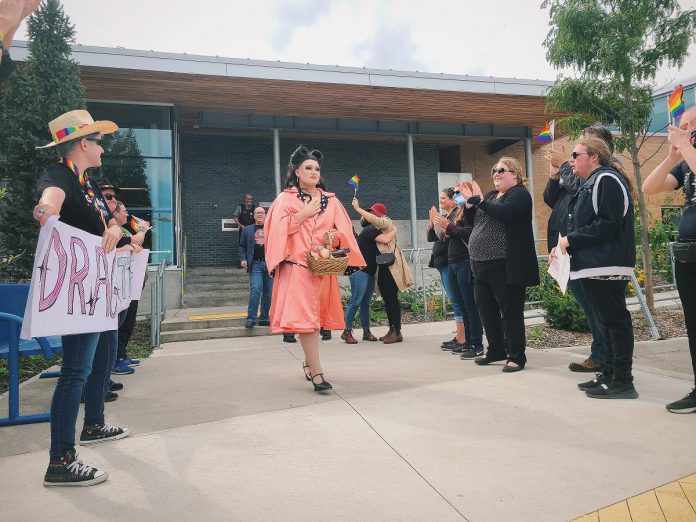 Peterborough drag performer Betty Baker reacts to supporters after leaving a drag queen story time event at the Peterborough Public Library on September 24, 2022. A protest against the event and against gender diversity was met by a larger counter-protest supporting the event and supporting gender diversity. (Photo courtesy of Jordan Lyall @jordanlyallphotography on Instagram)