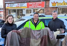 Fourcast manager Kerri Kightley, Peterborough County-City Paramedics deputy chief Craig Jones, and Windsor's Dry Cleaning Centre president Bruce Thompson outside Windsor's Dry Cleaning Centre at 655 Parkhill Road West in Peterborough during the announcement of the "Blankets for People" initiative on January 27, 2023. (Photo courtesy of Peterborough County)