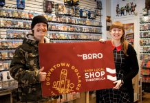 Holiday Shopping Passport grand prize draw winner Noah Sloan was presented with his grand prize of a $1,500 Boro gift card by Iceman Video Games store manager Holly Butler on January 14, 2023. Sloan completed his winning passport after purchasing a new game console at the downtown Peterborough business. (Photo courtesy of Peterborough DBIA)