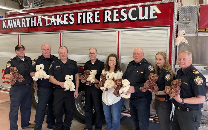 Rob and Monica Jardine (centre) of Jardine Funeral Home have donated 12 licensed Gund Teddy Bears to Kawartha Lakes Fire Rescue, so emergency responders can help comfort children who have been involved in a fire or other emergencies, with four fire stations each receiving three of the bears. Also pictured (from left to right) are Captain Chris Bacon of Station 12 Cameron, Fire Chief Terry Jones, Captain Scott Sabovitch of Station 20 Burnt River, frefighters Paul Weaver and MacKenzie Lunney of Station 19 Coboconk, and Station 22 Fenelon Falls Coordinator and Captain Don Barber. (Photo courtesy of City of Kawartha Lakes)